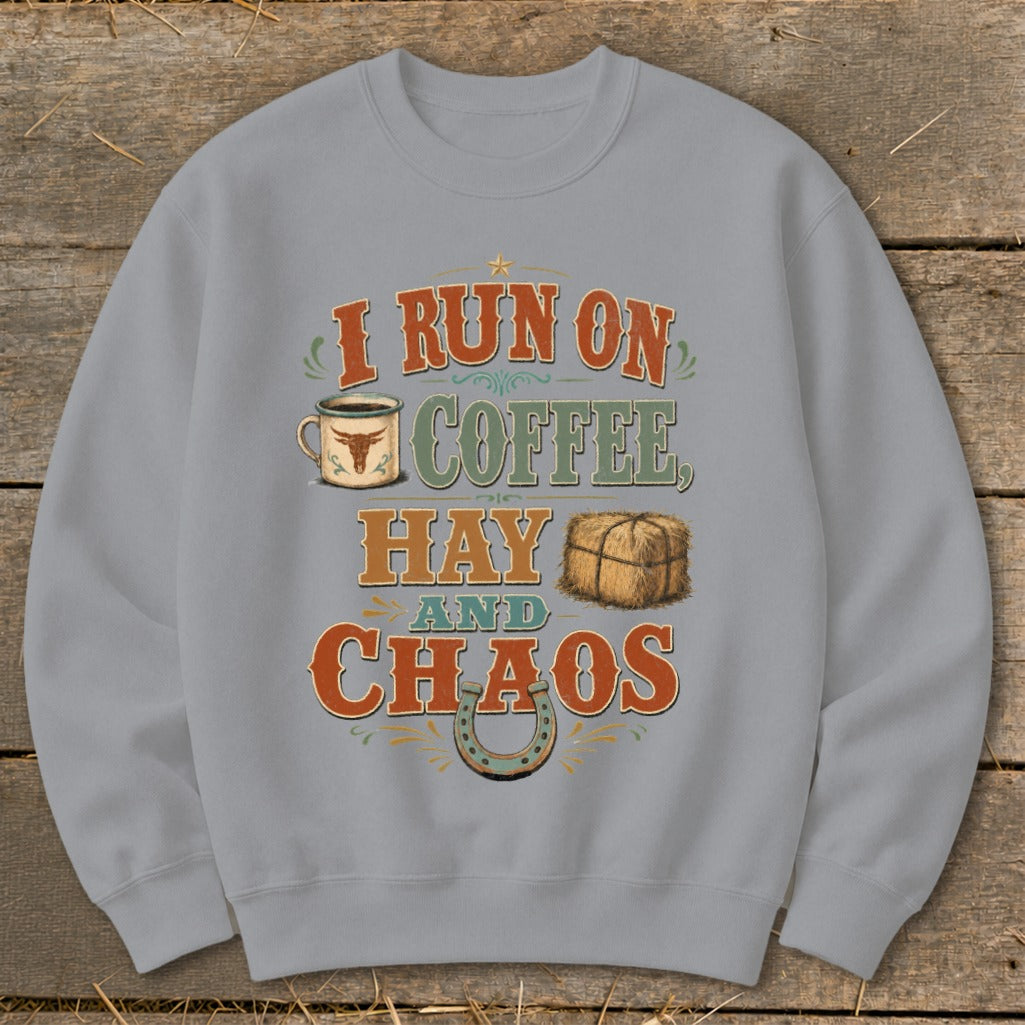 Crewneck sweatshirt with text "I run on coffee, hay and chaos" and graphics.