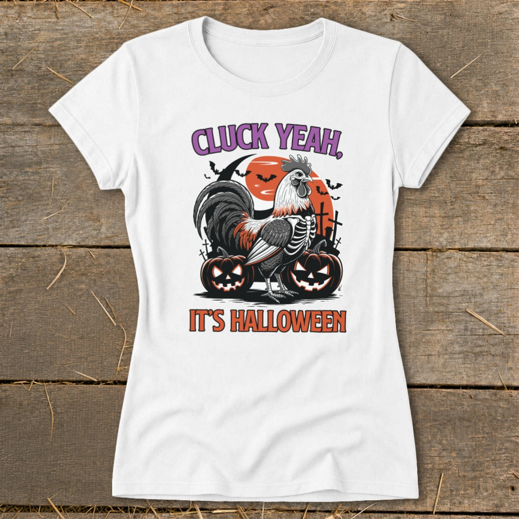 White t-shirt with skeleton rooster, pumpkins, and text "CLUCK YEAH, IT'S HALLOWEEN".