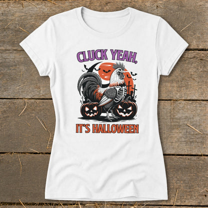 White t-shirt with skeleton rooster, pumpkins, and text "CLUCK YEAH, IT'S HALLOWEEN".