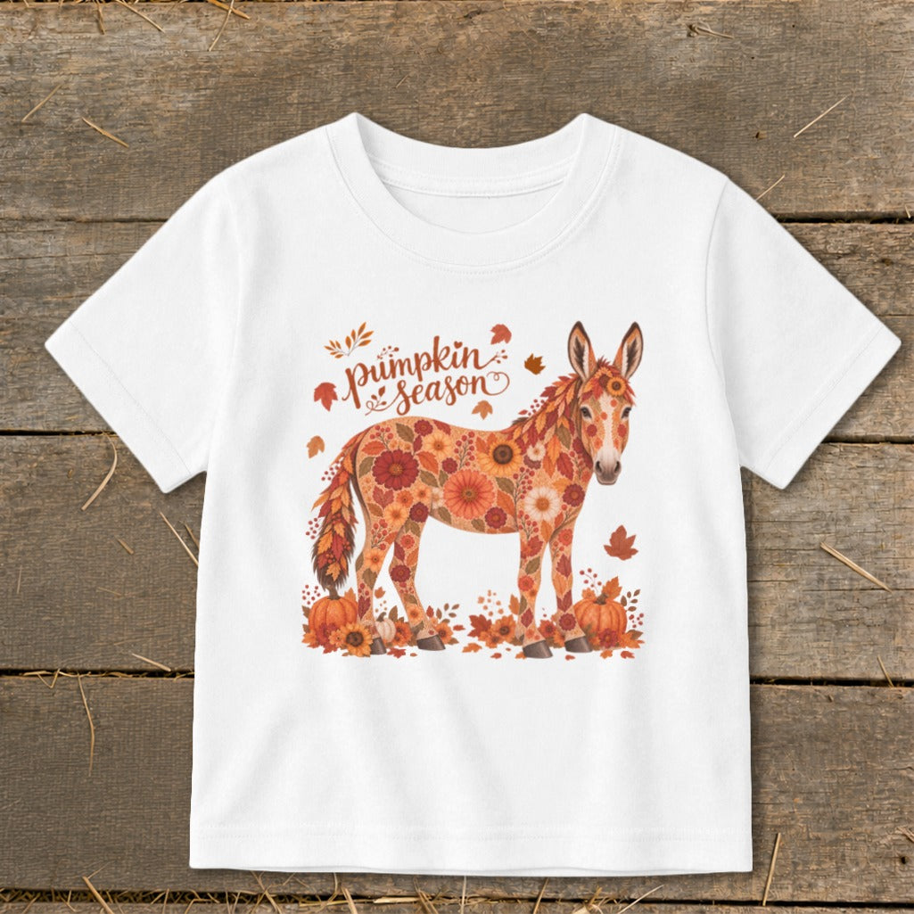 Donkey with floral pattern and "pumpkin season" text surrounded by autumn leaves and pumpkins.