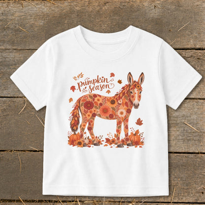 Donkey with floral pattern and "pumpkin season" text surrounded by autumn leaves and pumpkins.