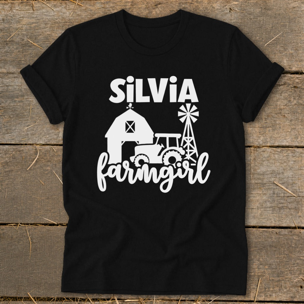 Black t-shirt with "Silvia farmgirl" text and farm scene graphic.