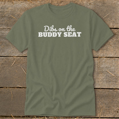Green t-shirt with white text that reads "Dibs on the Buddy Seat".