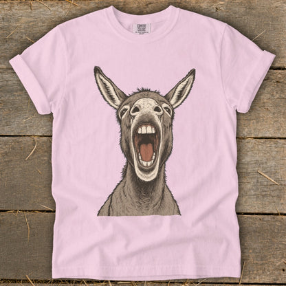 Pink t-shirt with a drawing of a donkey with its mouth wide open.