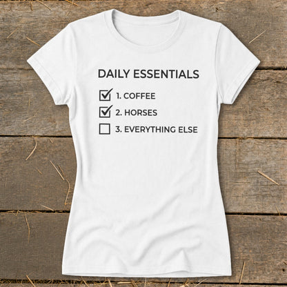 White t-shirt with "Daily Essentials" list: 1. Coffee, 2. Horses, 3. Everything Else.