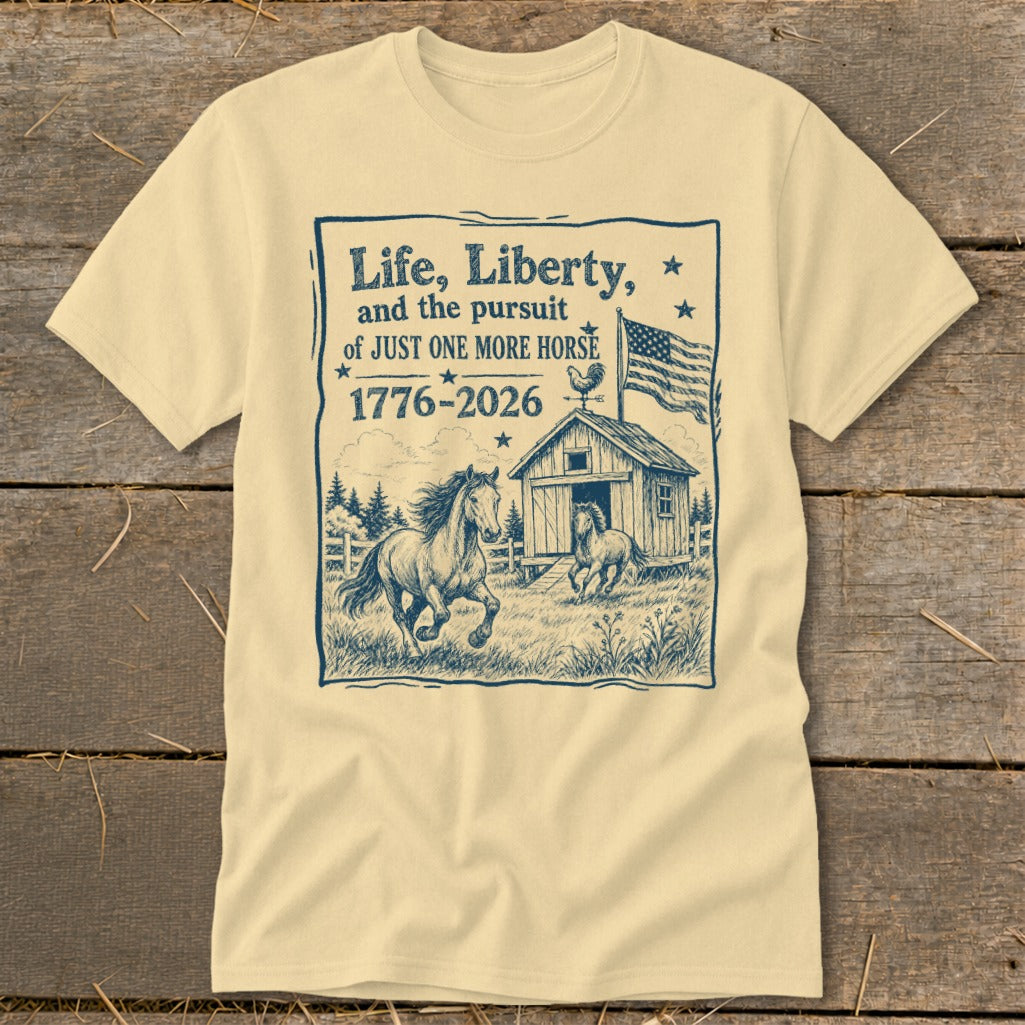 T-shirt with "Life, Liberty, and the pursuit of JUST ONE MORE HORSE 1776-2026" text and horse barn illustration.