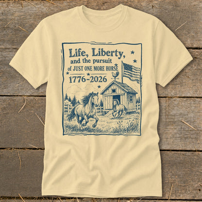 T-shirt with "Life, Liberty, and the pursuit of JUST ONE MORE HORSE 1776-2026" text and horse barn illustration.