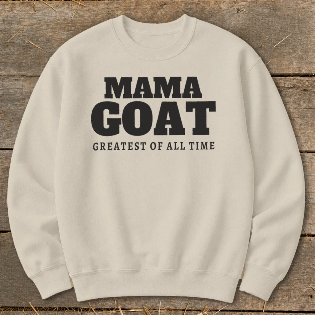 Cream sweatshirt with black text "MAMA GOAT GREATEST OF ALL TIME".