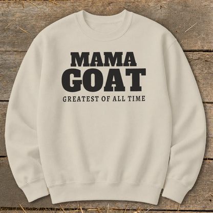 Cream sweatshirt with black text "MAMA GOAT GREATEST OF ALL TIME".