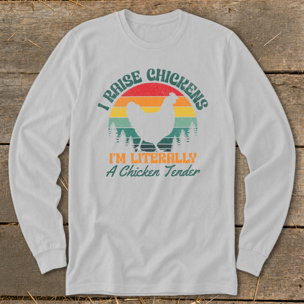 White long-sleeve shirt with retro sunset graphic and text: "I RAISE CHICKENS I'M LITERALLY A Chicken Tender".