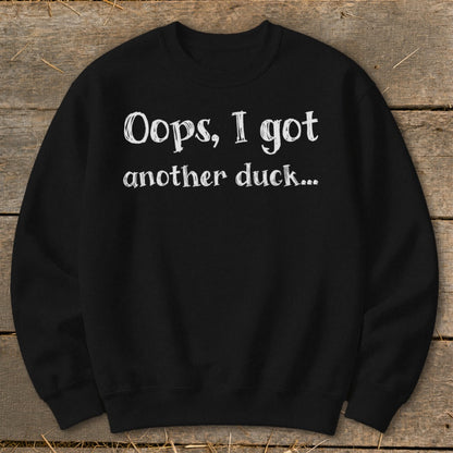 Black sweatshirt with white text: "Oops, I got another duck..."