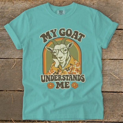 Graphic tee with a goat wearing glasses and a floral shirt, reads "My Goat Understands Me".