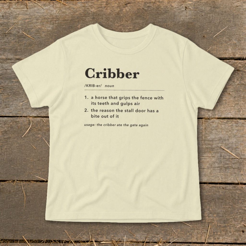 Cream-colored t-shirt featuring a dictionary definition of the word Cribber printed in black on the front.