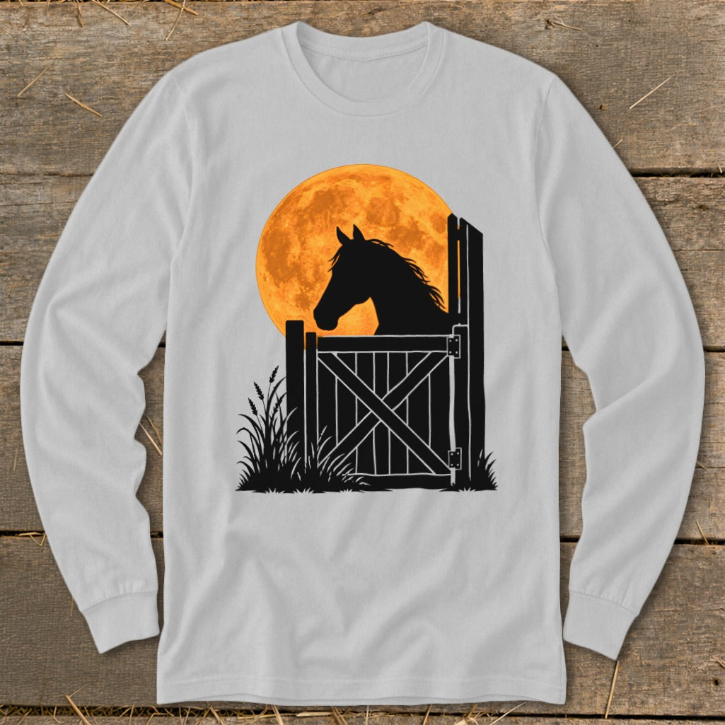 A long-sleeve light gray t-shirt featuring a graphic of a horse's silhouette at a stable door before a large orange moon.