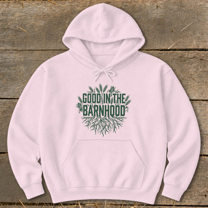 Light pink hoodie with green text "GOOD IN THE BARNHOOD" and root graphic.