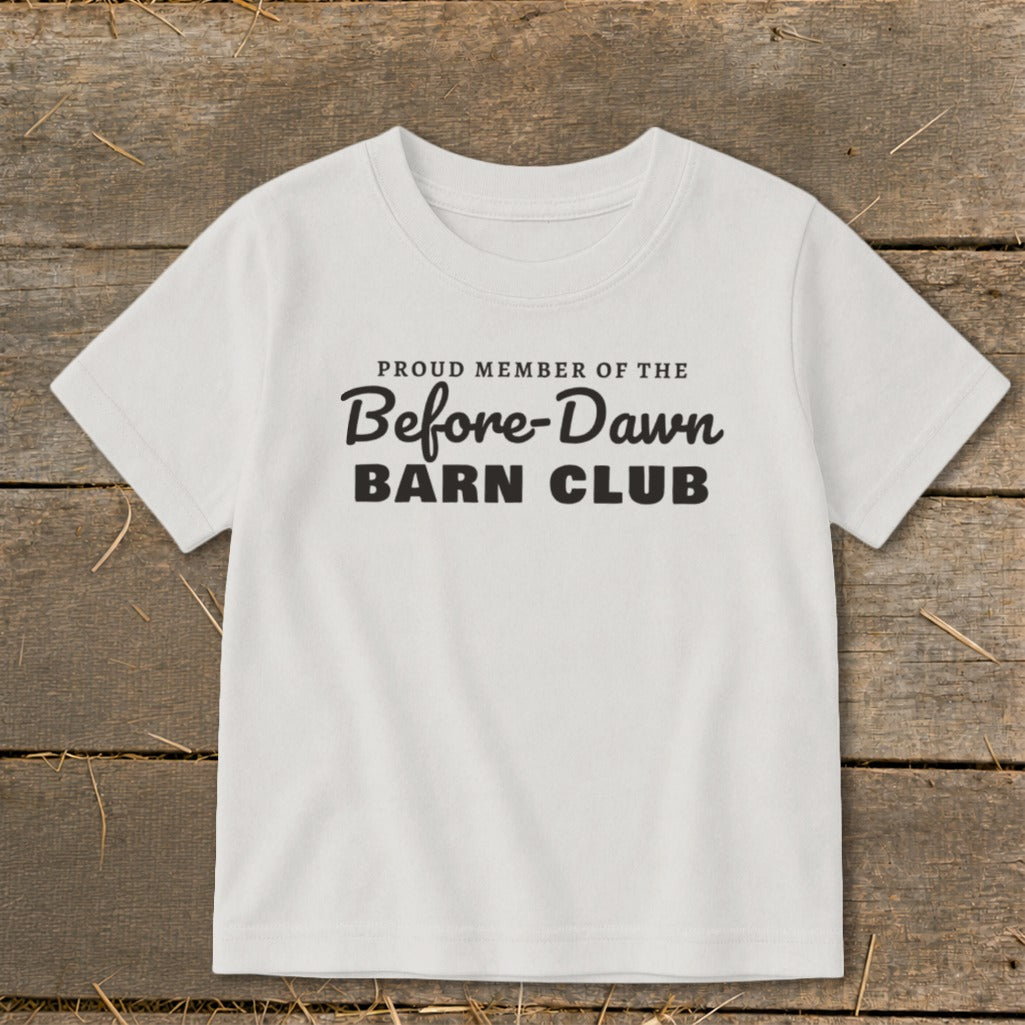 White t-shirt with black text: "PROUD MEMBER OF THE Before-Dawn BARN CLUB".