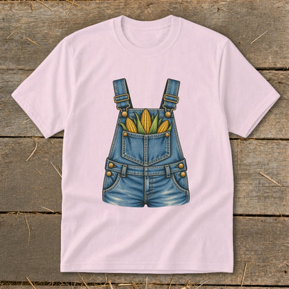 Pink t-shirt with a denim overalls graphic featuring three corn ears.