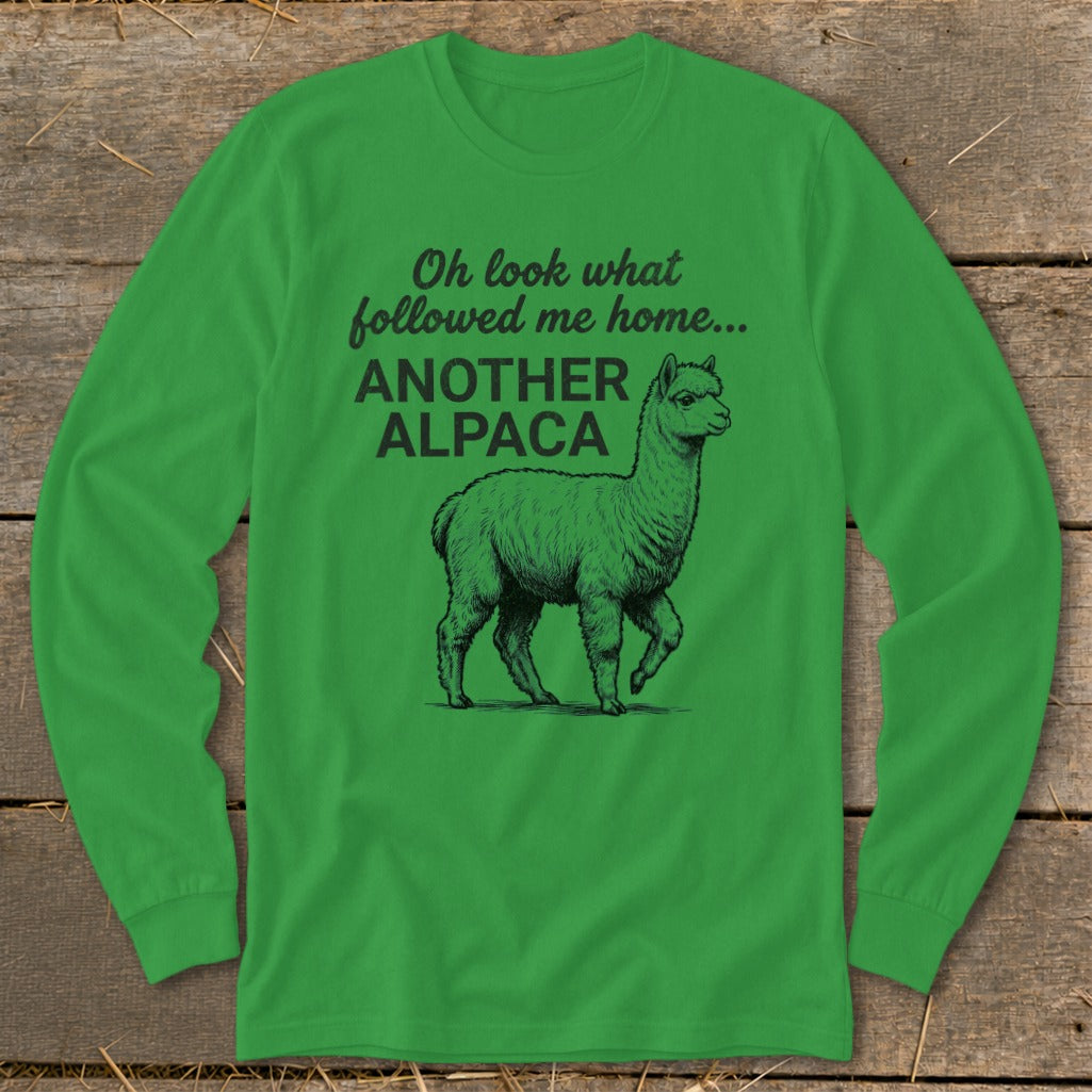 Green long-sleeved shirt with text "Oh look what followed me home... ANOTHER ALPACA" and an alpaca illustration.