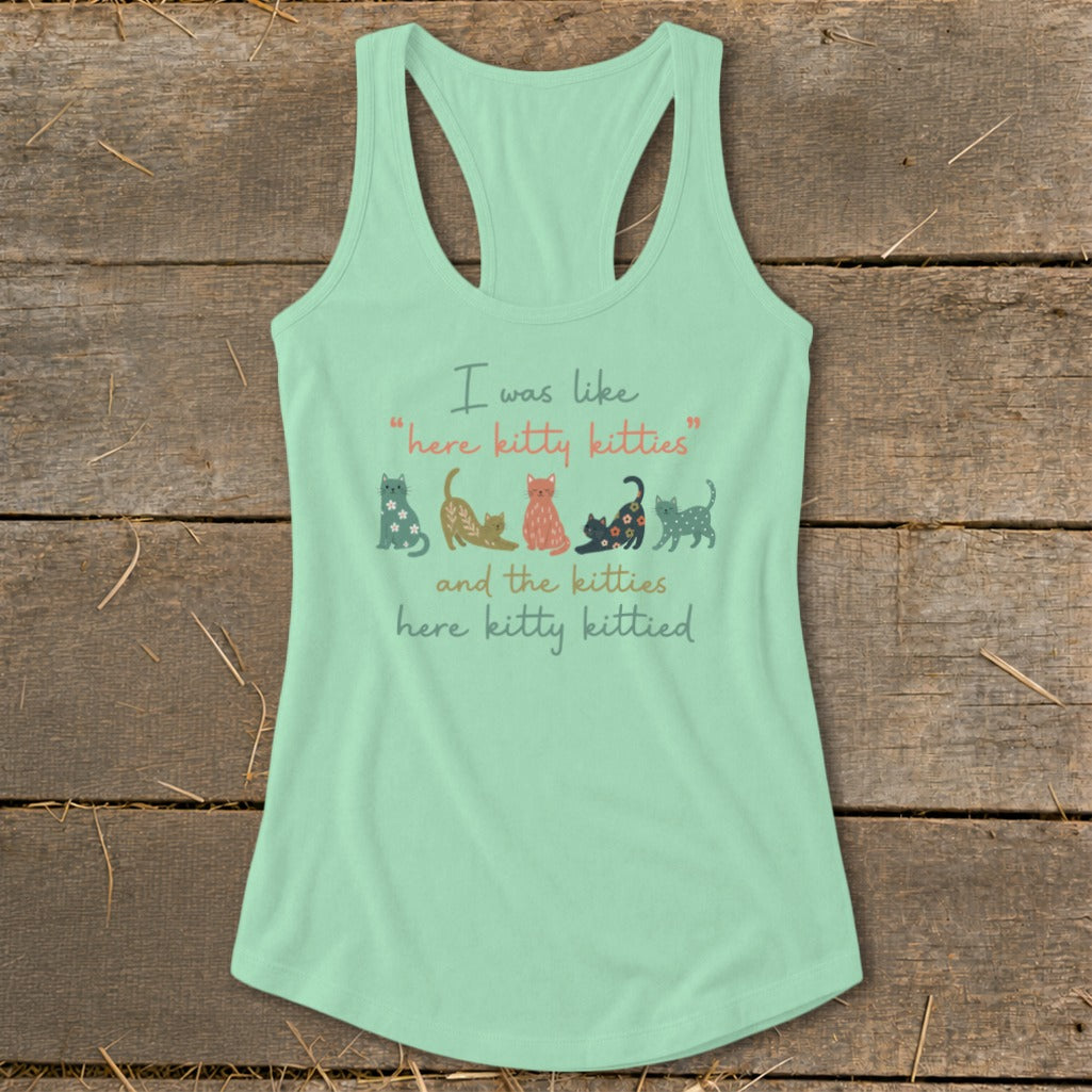 Mint green tank top with colorful cats and text: "I was like 'here kitty kitties' and the kitties here kitty kittied."