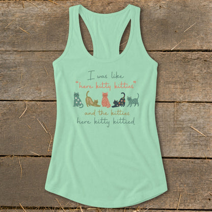 Mint green tank top with colorful cats and text: "I was like 'here kitty kitties' and the kitties here kitty kittied."
