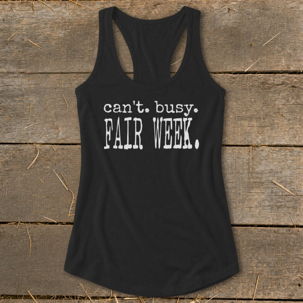 Black racerback tank top with white text "can't. busy. FAIR WEEK."