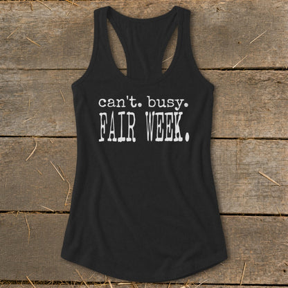 Black racerback tank top with white text "can't. busy. FAIR WEEK."