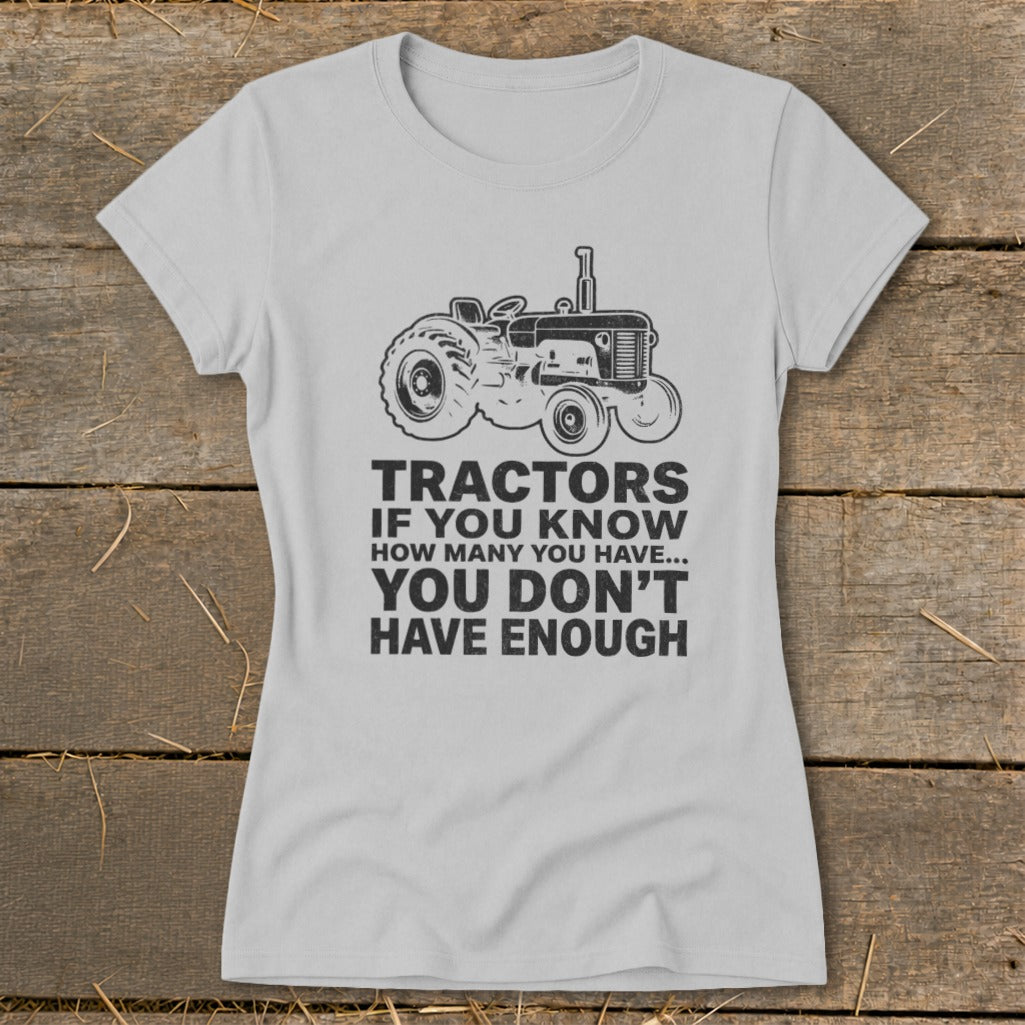 Grey t-shirt with tractor graphic and text "Tractors if you know how many you have... you don't have enough."