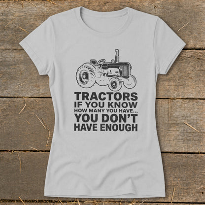 Grey t-shirt with tractor graphic and text "Tractors if you know how many you have... you don't have enough."