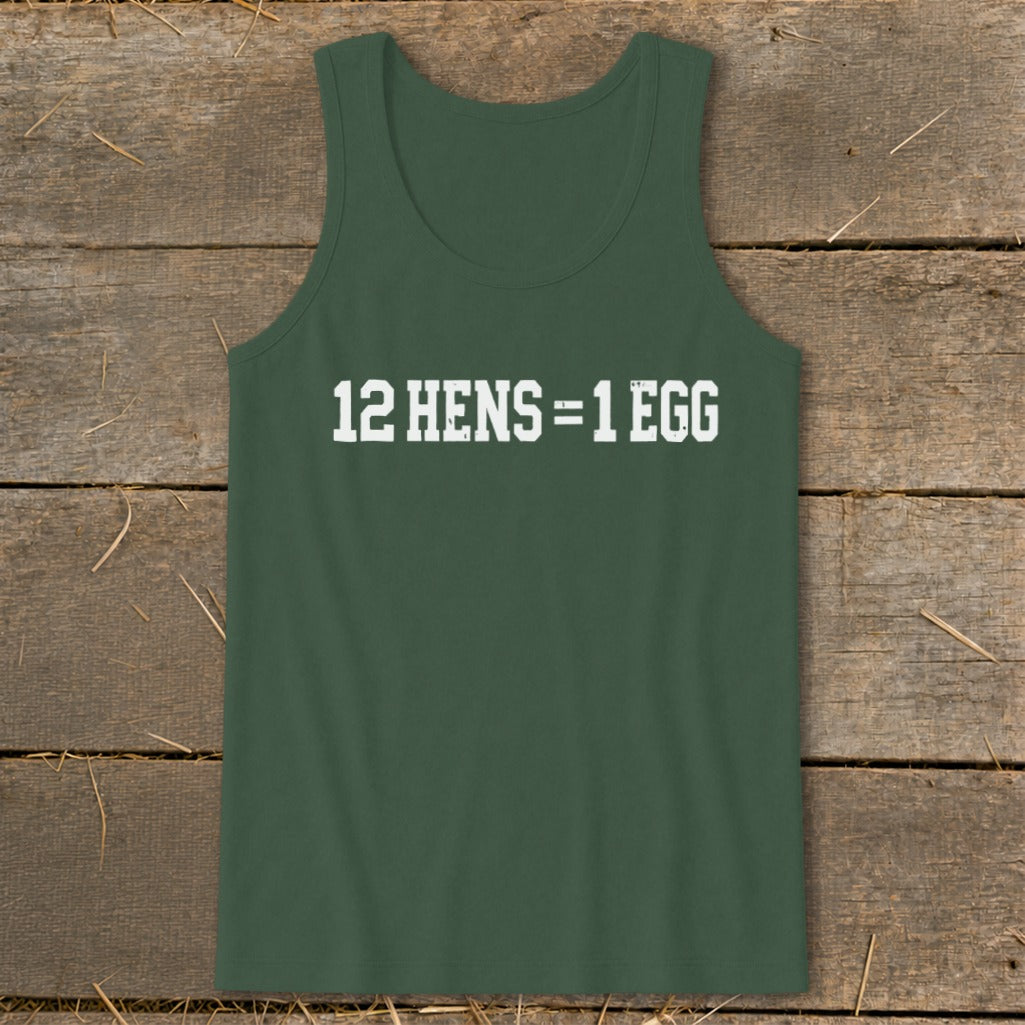 A dark green tank top laid flat on a rustic wooden surface, featuring the white text 12 HENS = 1 EGG across the chest.