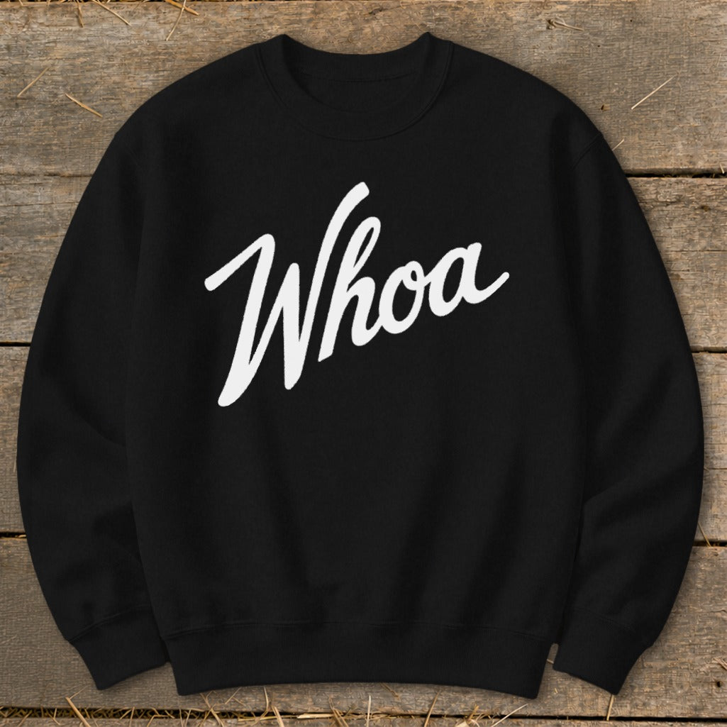 Black crewneck sweatshirt with white "Whoa" text across the chest.