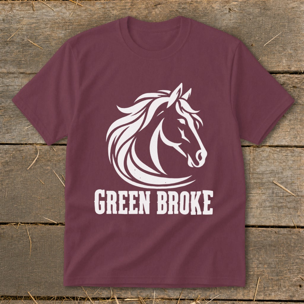 Maroon short-sleeved t-shirt featuring a white graphic of a horse head and the text GREEN BROKE.
