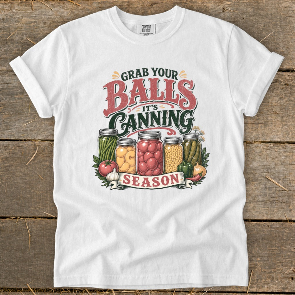 White t-shirt with "Grab Your Balls It's Canning Season" graphic featuring mason jars.