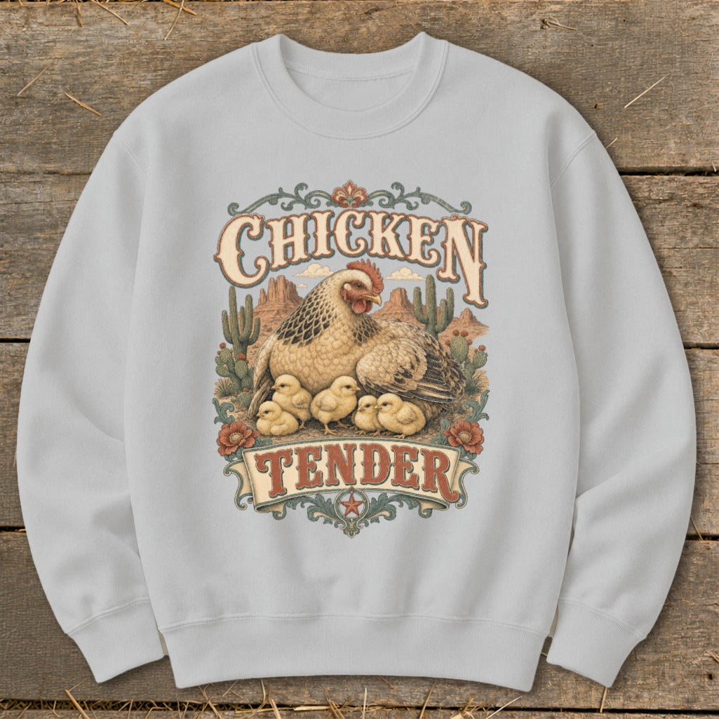 Chicken Tender graphic on sweatshirt with hen and chicks in desert landscape.