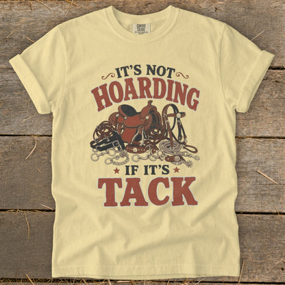 "It's Not Hoarding If It's Tack" graphic on a light yellow t-shirt with horse tack.