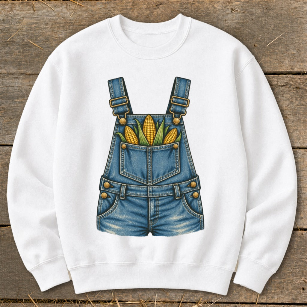 White sweatshirt with a denim overalls graphic filled with corn on the cob.