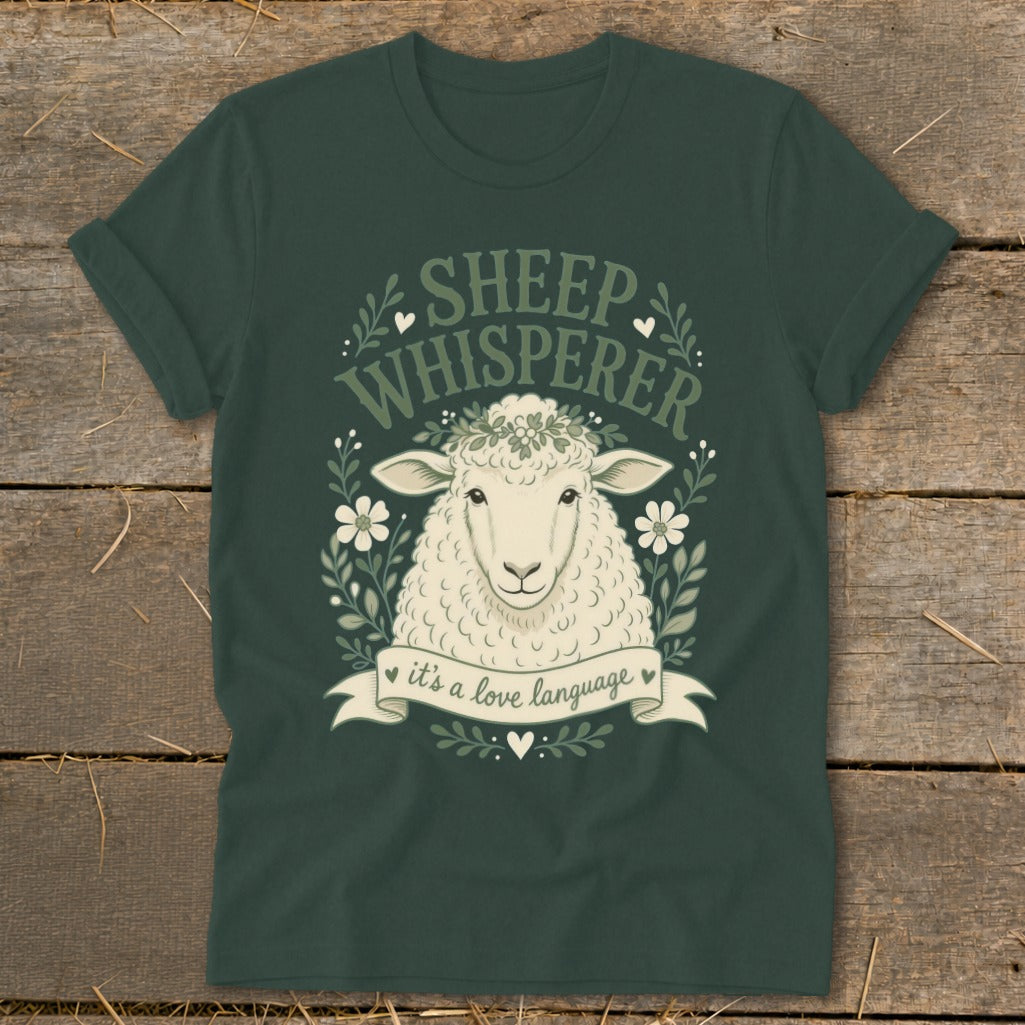 Dark green t-shirt with sheep illustration and "Sheep Whisperer it's a love language" text.
