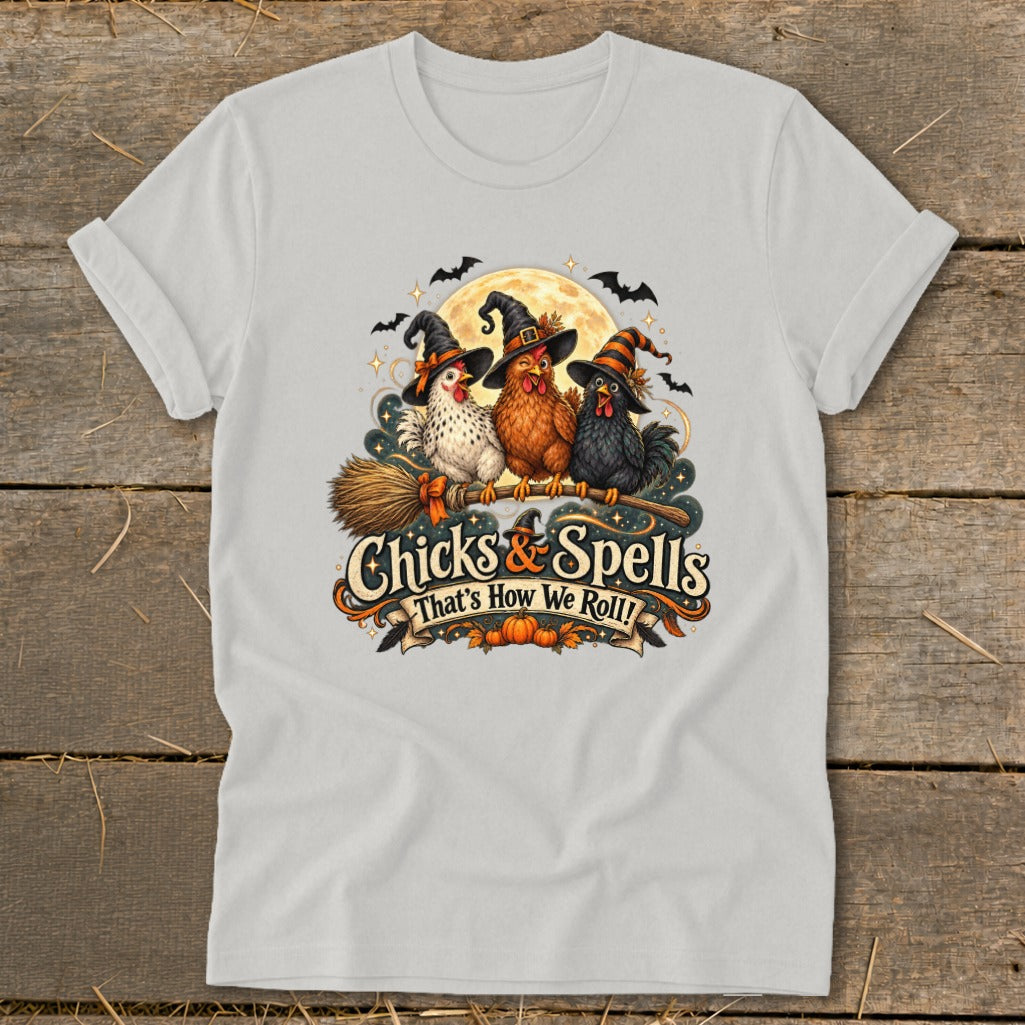 Three chickens in witch hats on a broom with "Chicks & Spells" text.