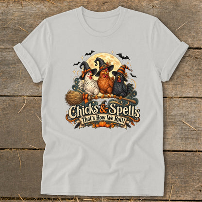 Three chickens in witch hats on a broom with "Chicks & Spells" text.