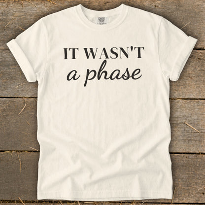 Cream t-shirt with black text "IT WASN'T a phase".