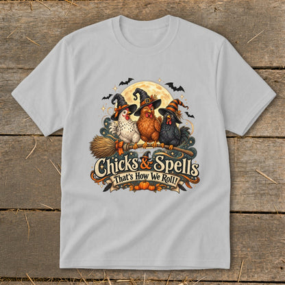 Three witches' chickens in hats on a broomstick with "Chicks & Spells" text.