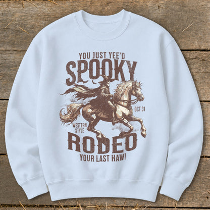 Spooky Western Style Rodeo graphic with a cowboy riding a horse and text "YOU JUST YEE'D SPOOKY".
