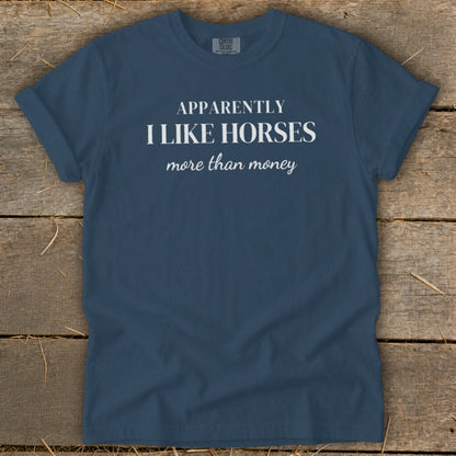 Dark blue t-shirt with text "Apparently I like horses more than money."