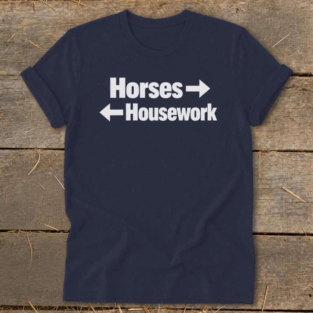 Navy blue short-sleeve t-shirt with white text reading Horses with a right arrow and Housework with a left arrow.