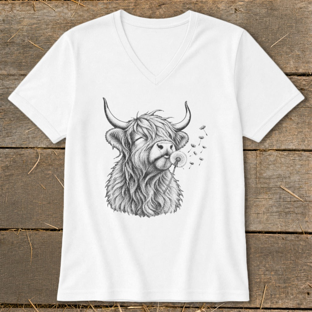 White t-shirt with sketch of Highland cow blowing dandelion seeds.