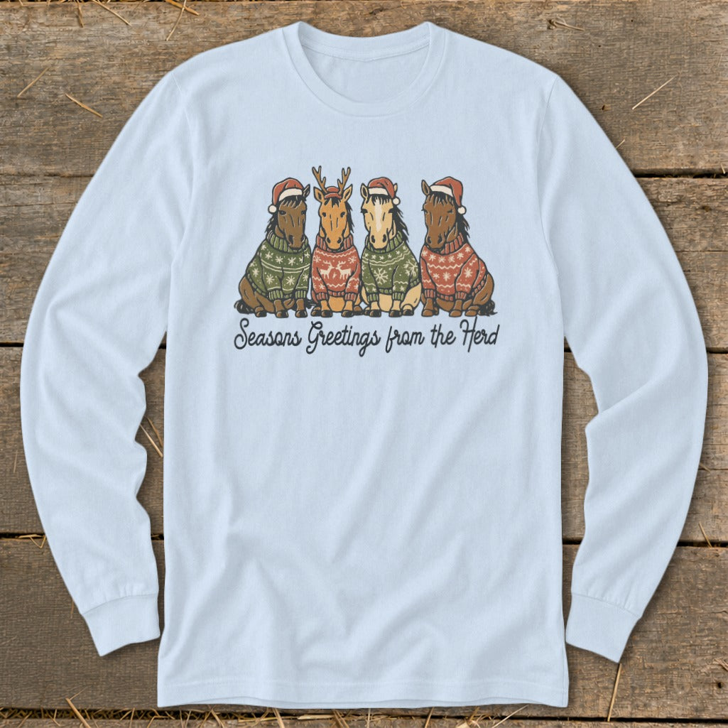 Light blue long-sleeve shirt with four horses wearing Christmas sweaters and hats.
