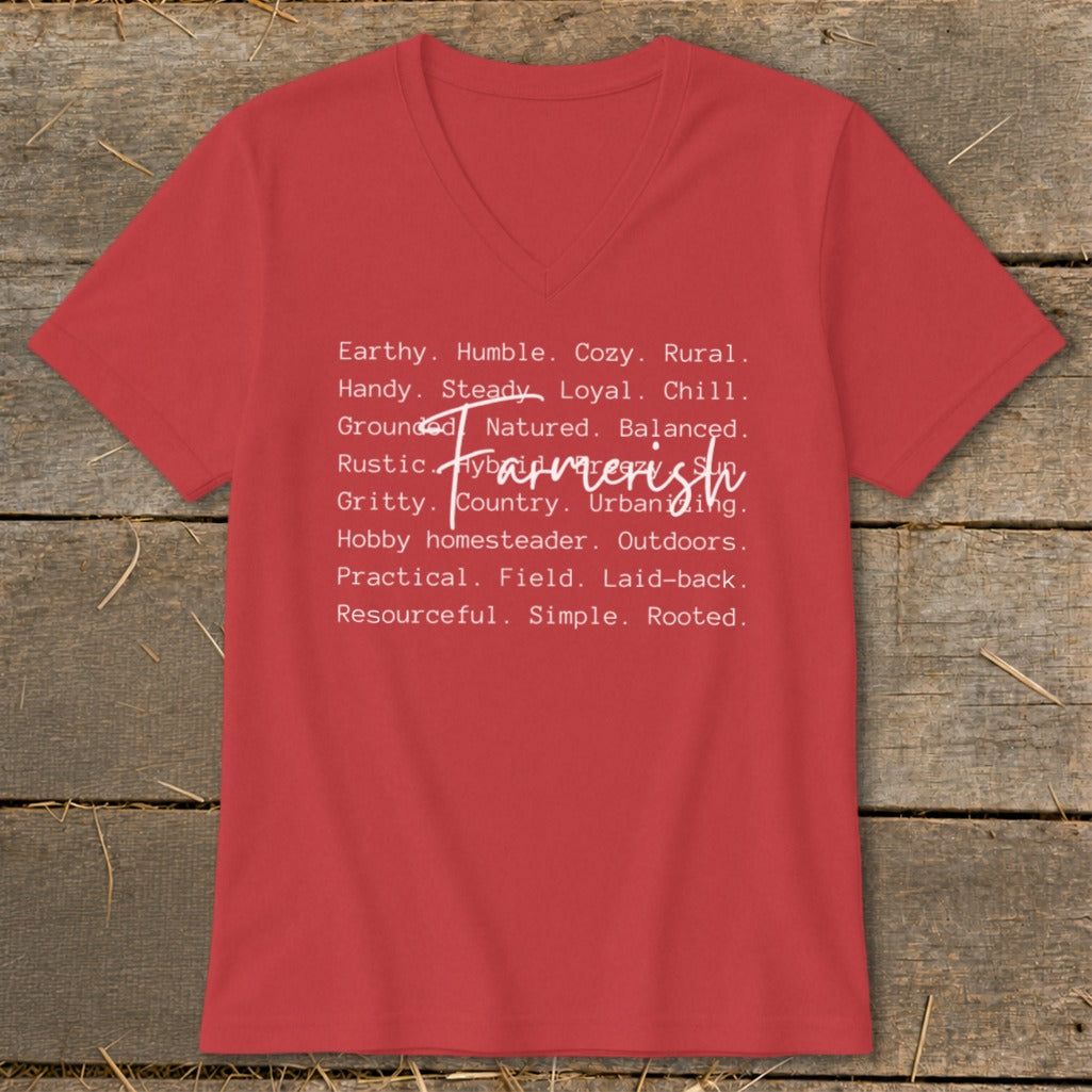 Red v-neck t-shirt with white text listing traits like "Earthy," "Humble," and "Farmerish."