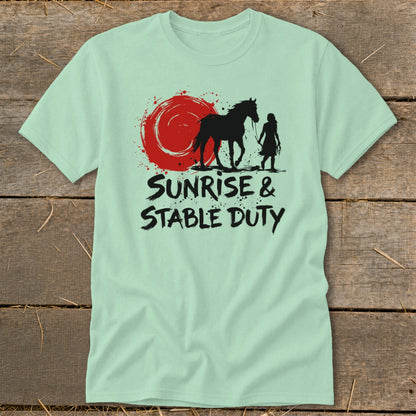 Mint t-shirt with black graphic of horse and person under a red sun, text "Sunrise & Stable Duty".