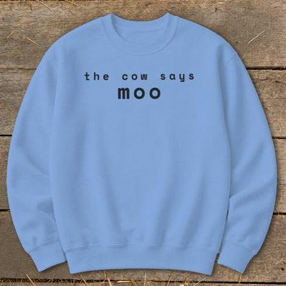 Light blue crewneck sweatshirt with black text "the cow says moo".