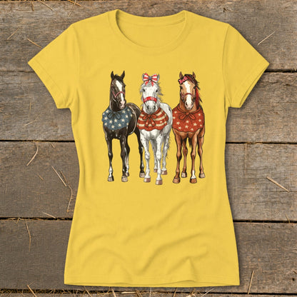 Three horses in patriotic attire stand side-by-side on a yellow t-shirt.