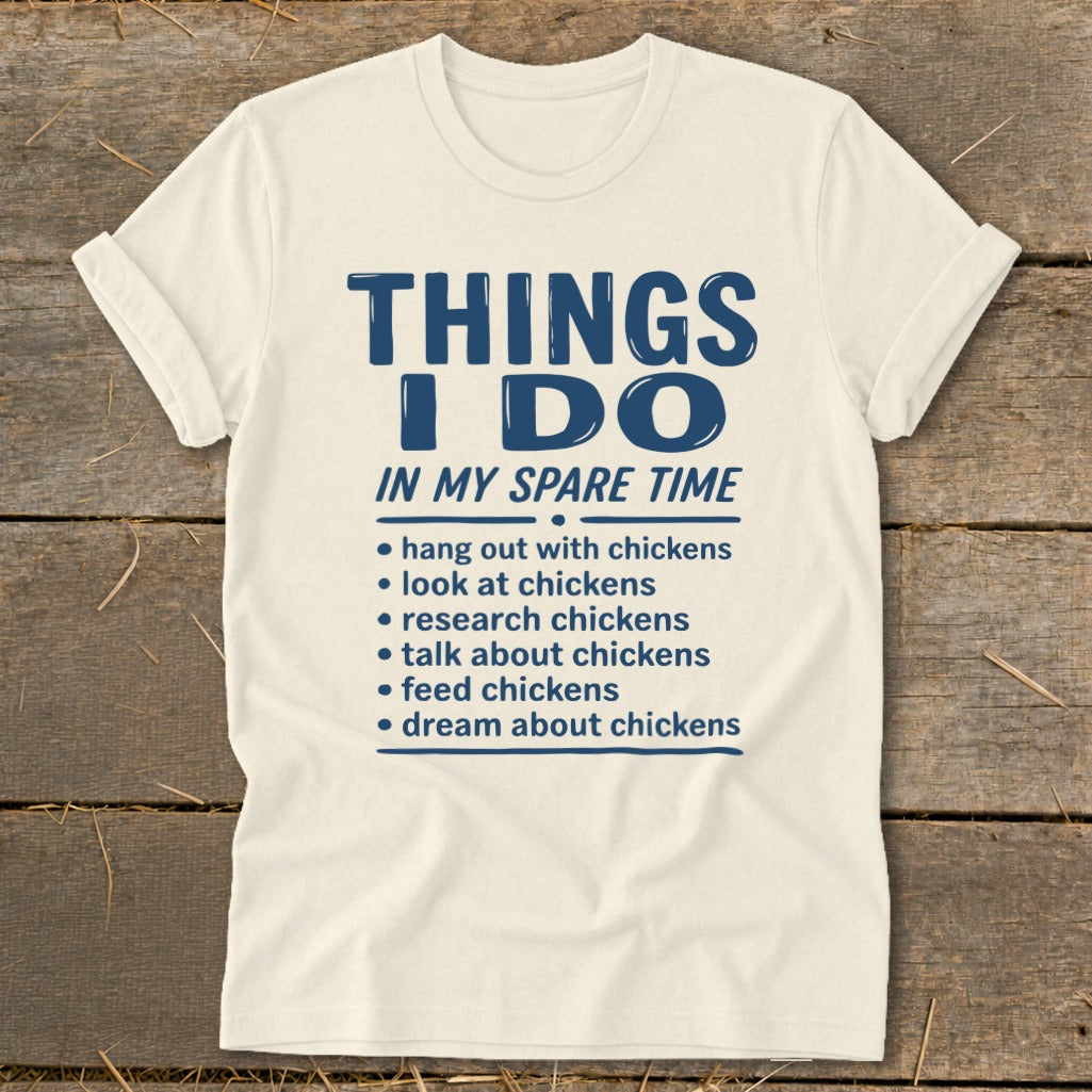 Cream t-shirt with "Things I Do In My Spare Time" and chicken-related activities.